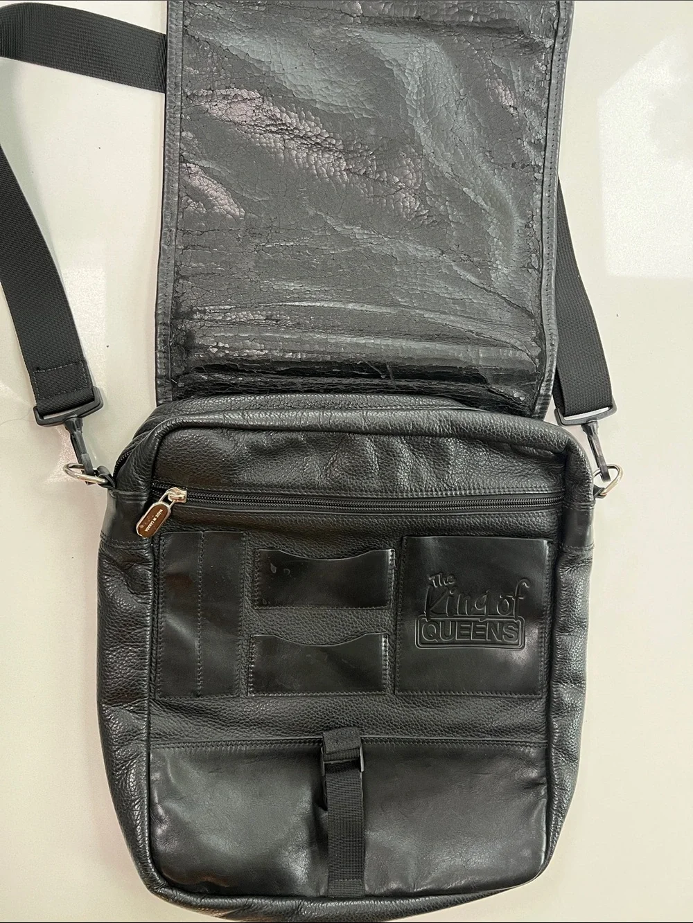Men's Black Leather Messenger Bag by Roots with Top Handle and Adjustable Strap